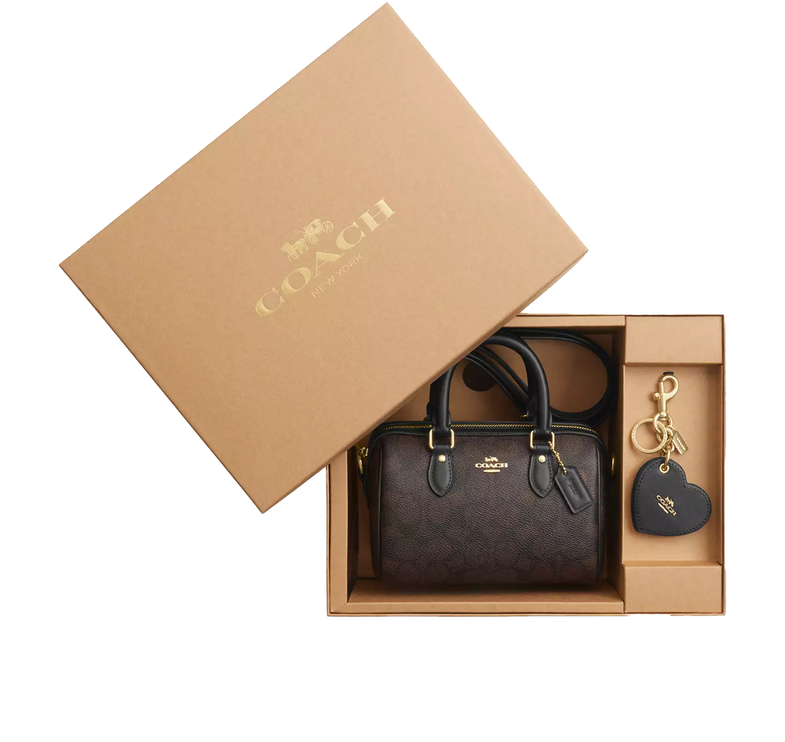 Coach Women's Boxed Mini Rowan Crossbody Bag And Mirror Bag Charm Set In Signature Canvas Gold/Walnut/Black - Hemen Kargoda